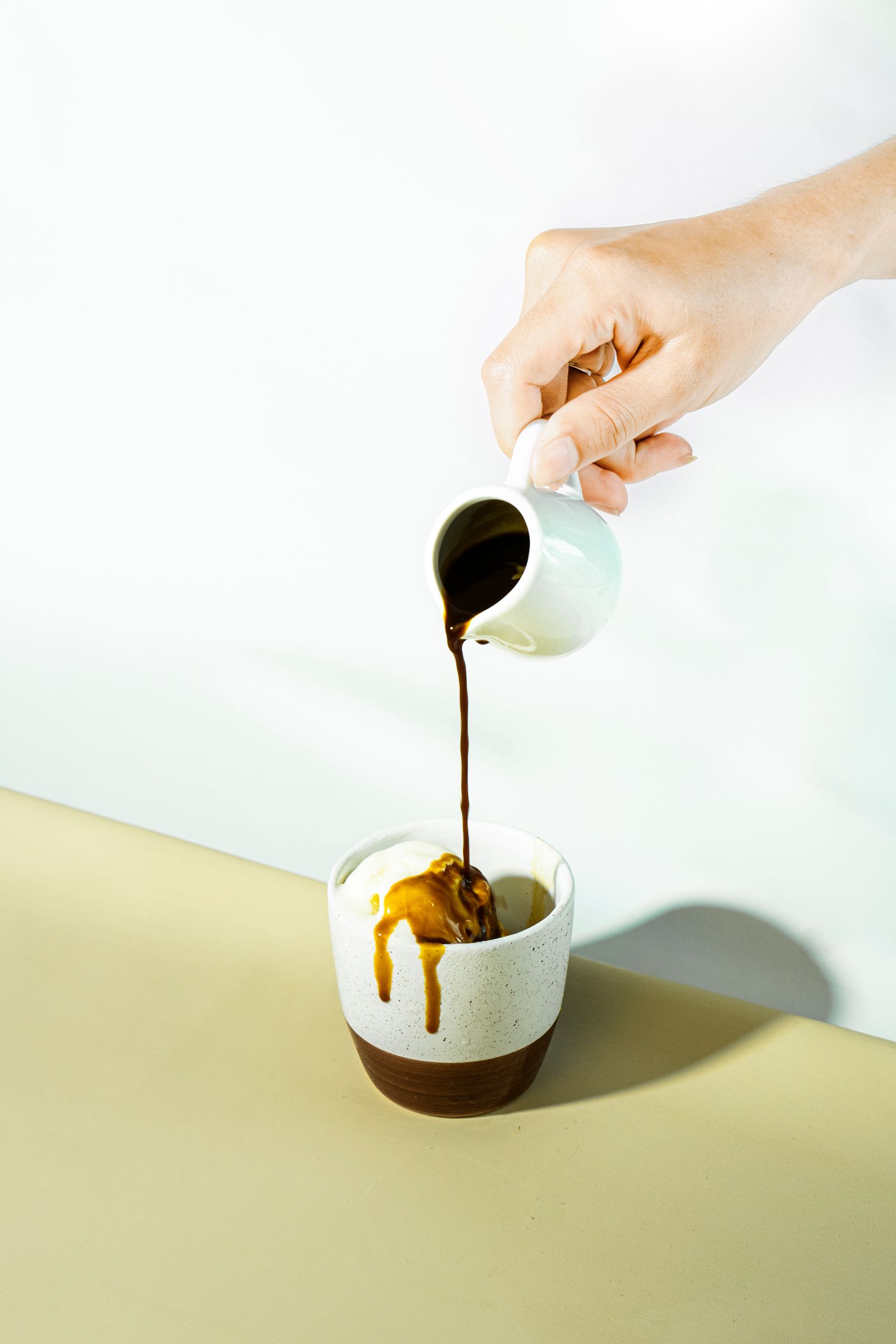 Espresso being poured over a scoop of vanilla ice cream in a ceramic cup (placeholder — awaiting client photos)