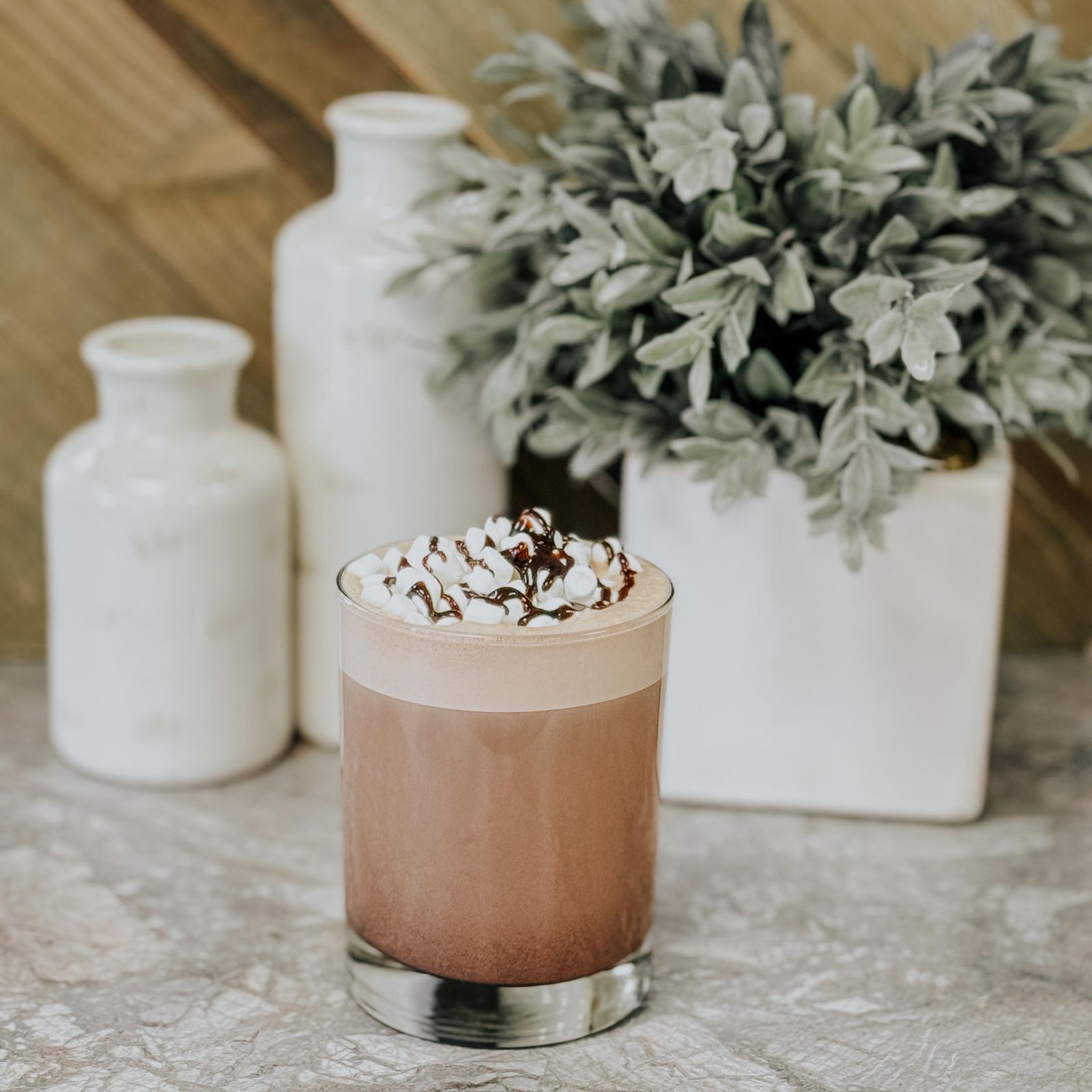 Hot chocolate topped with marshmallows and a chocolate drizzle (placeholder — awaiting client photos)