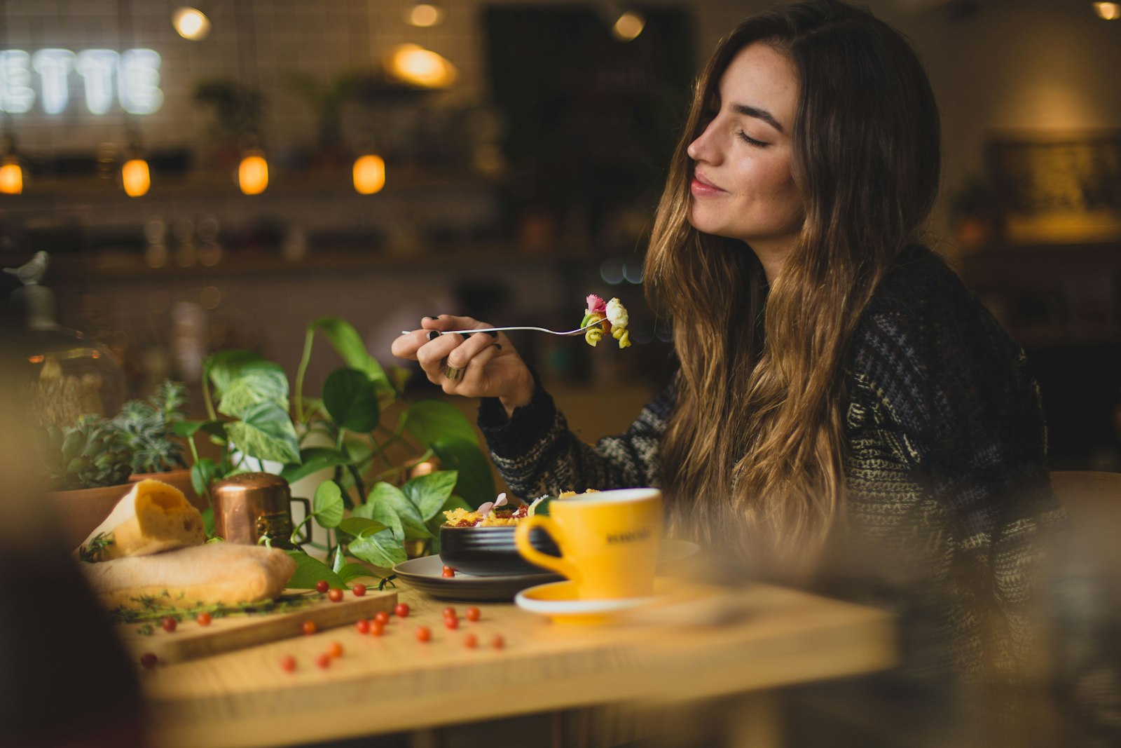 Guest enjoying a meal in warm afternoon light (placeholder — awaiting client photos)